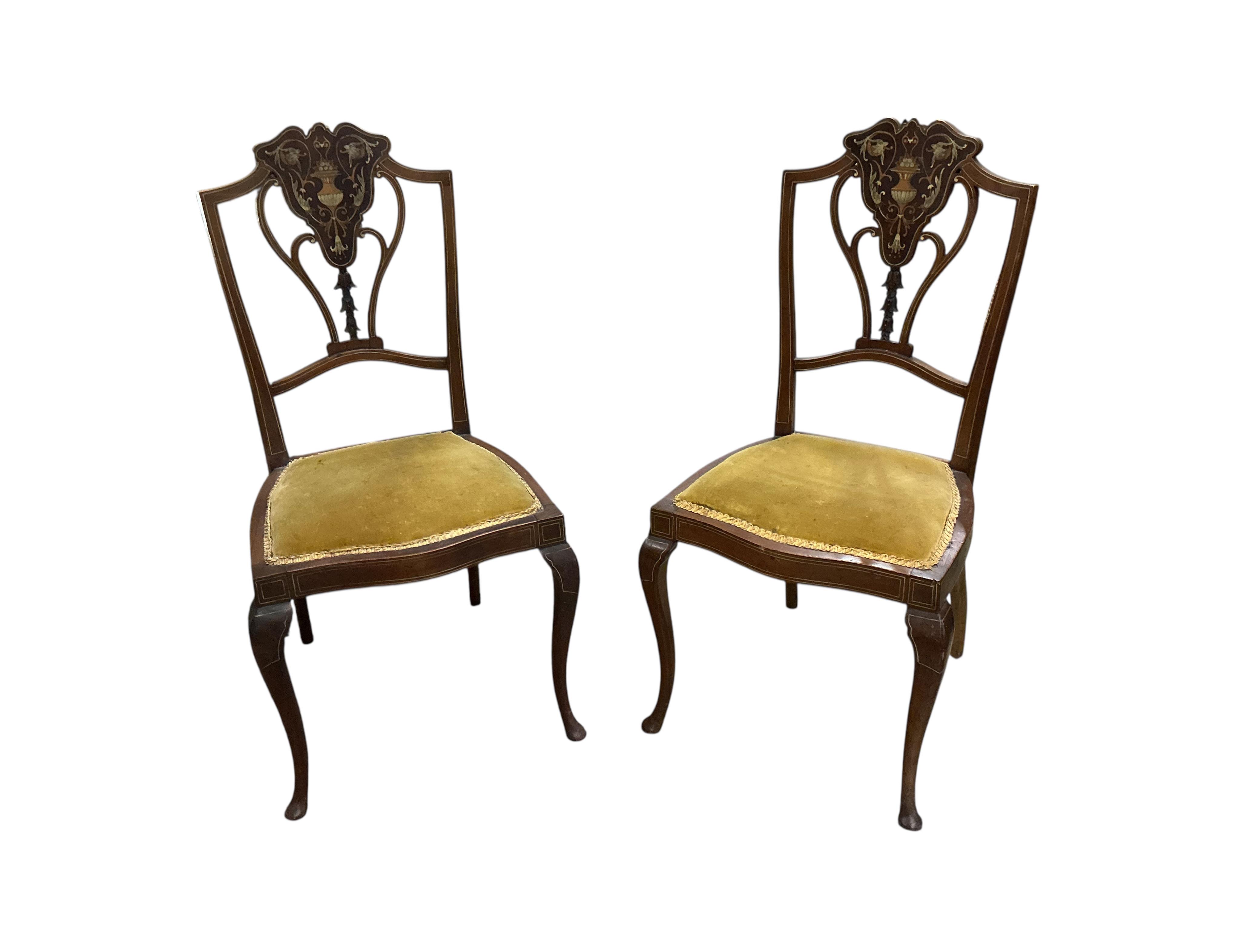 A set of eight Edwardian marquetry inlaid mahogany dining chairs, two with arms